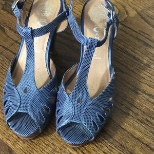 Blue stacked cutout heels with dark wood soles